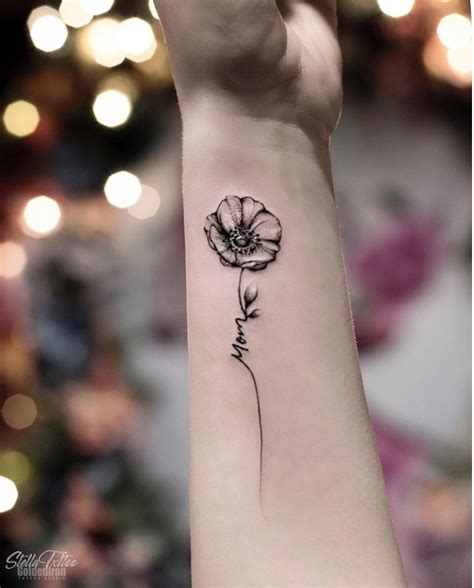 flower tattoo wrist|small flower tattoos on wrist.